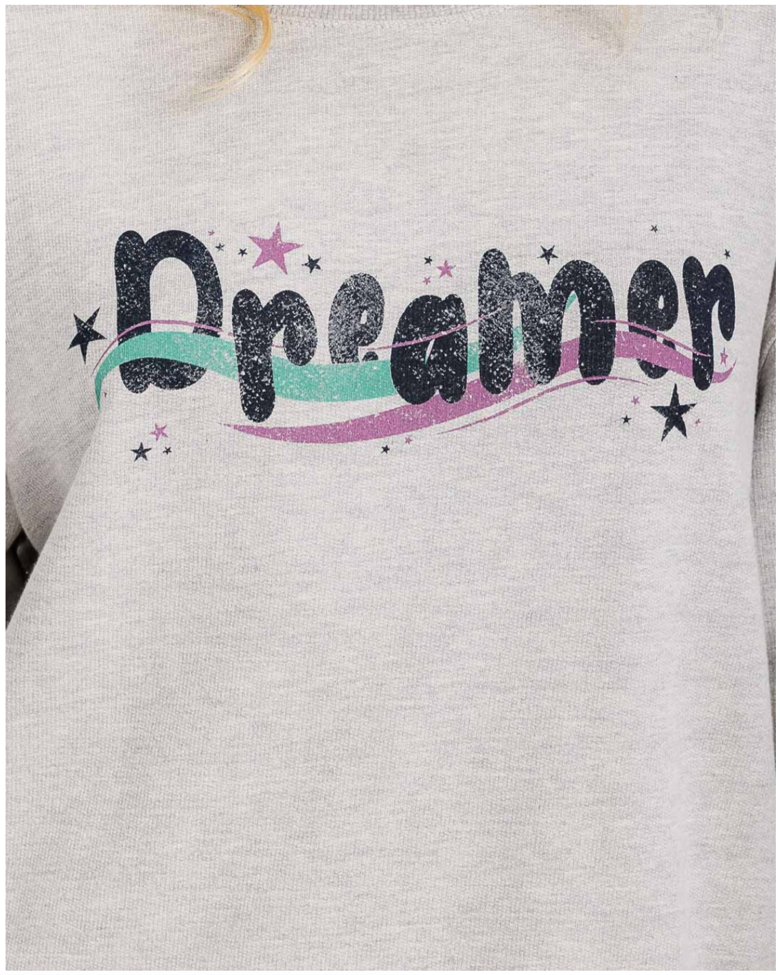 Gray sweatshirt with 'Dreamer' text and star graphics on a plain background